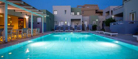 Seasonal outdoor pool, open 9:00 AM to 7:30 PM, pool umbrellas