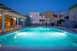 Seasonal outdoor pool, open 9:00 AM to 7:30 PM, pool umbrellas
