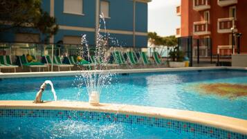 Seasonal outdoor pool, pool umbrellas, sun loungers
