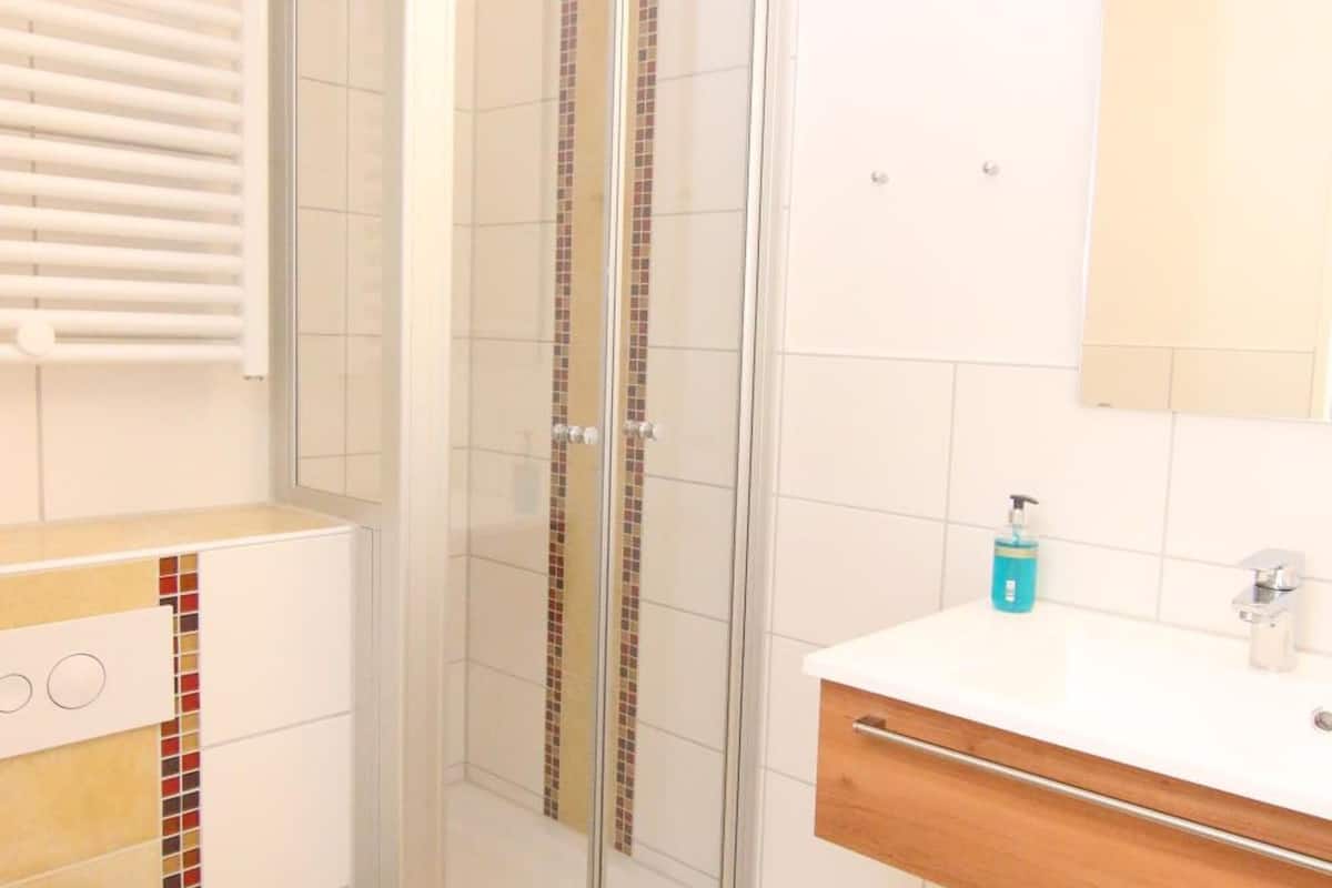 shower, hair dryer, bathrobes, towels