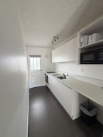 Family Apartment, 2 Bedrooms | Private kitchen | Fridge, microwave, electric kettle, toaster