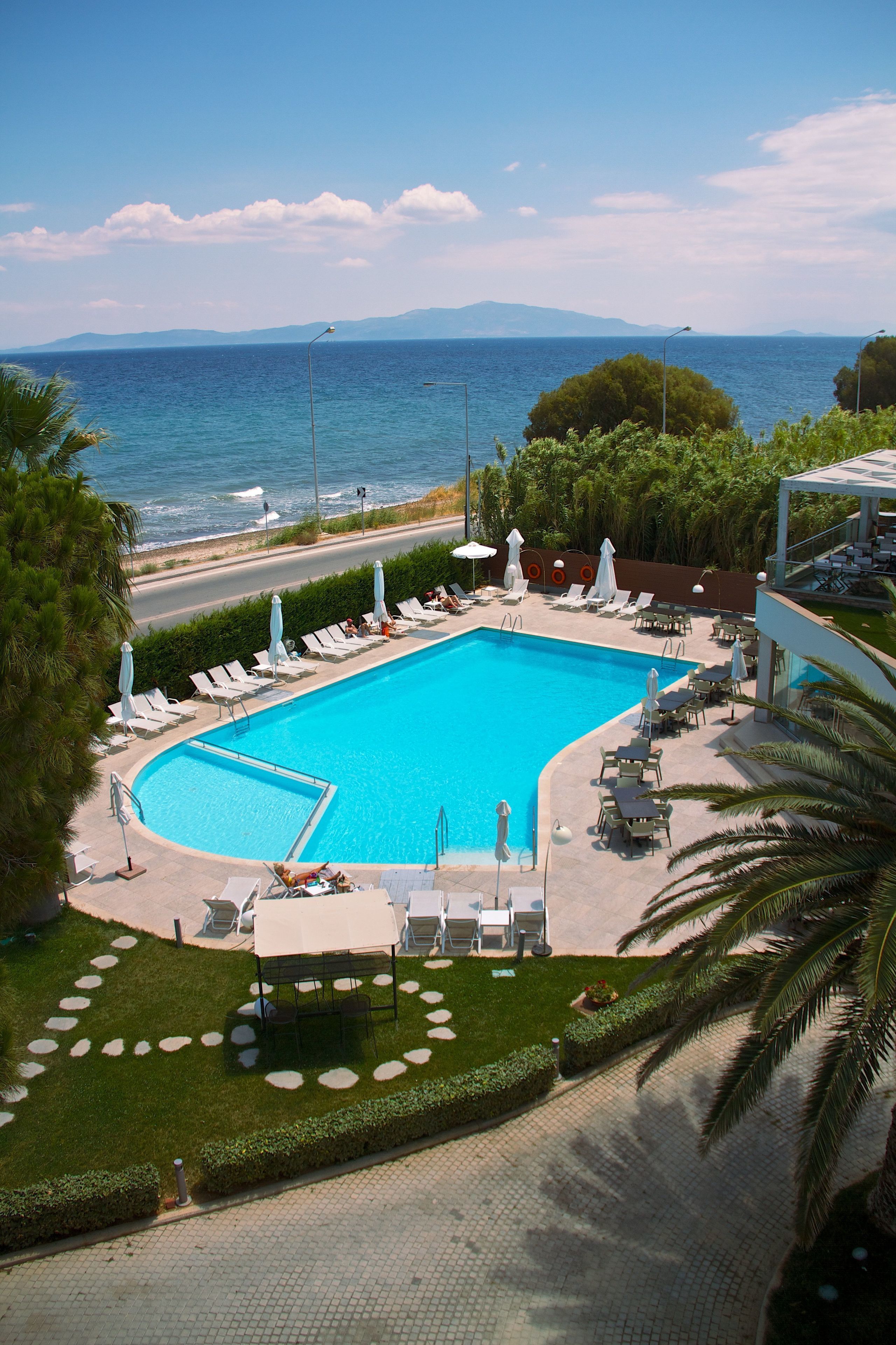 Outdoor pool, open 11:00 AM to 7:00 PM, pool umbrellas, pool loungers