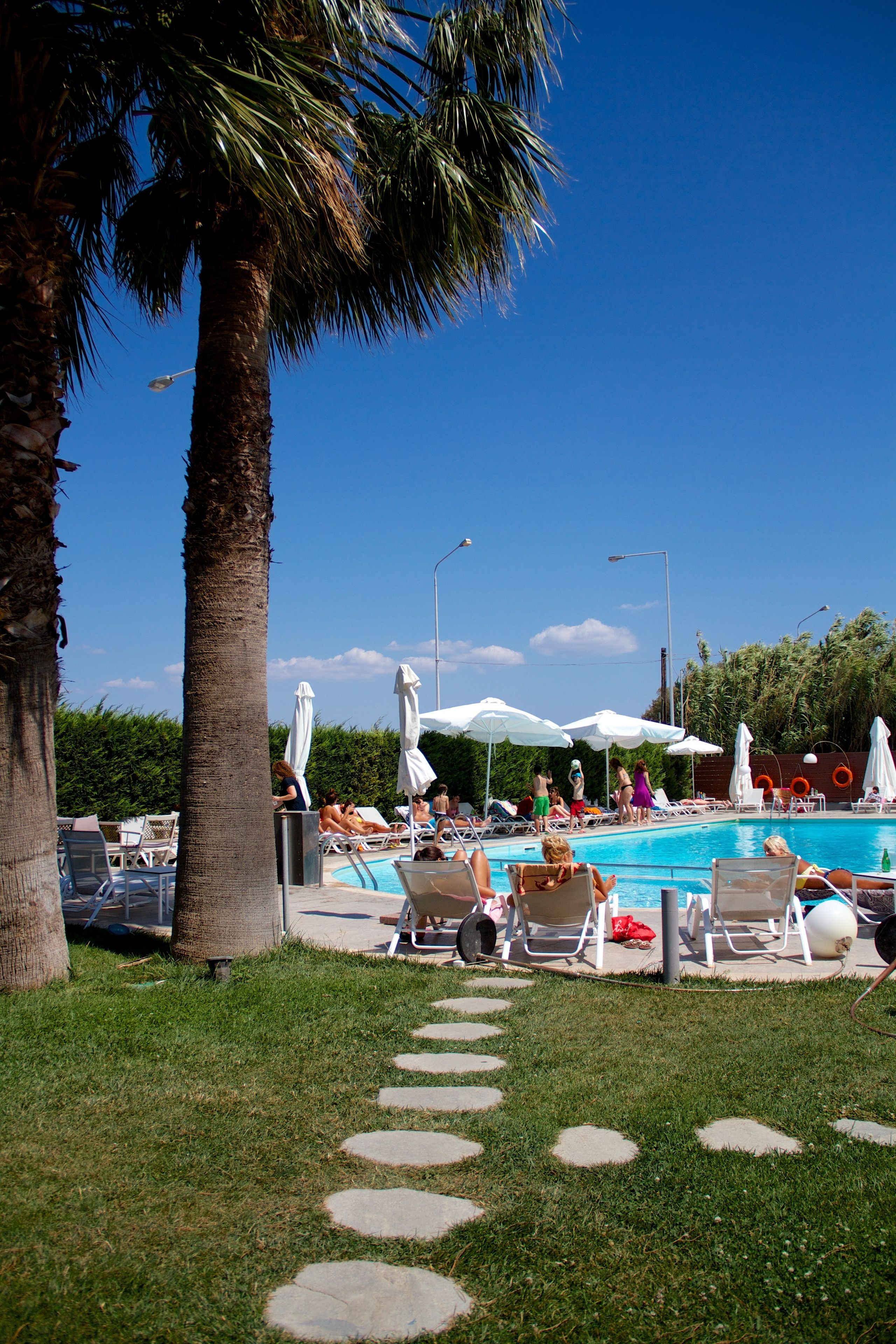 outdoor pool, open 11:00 am to 7:00 pm, pool umbrellas, pool loungers