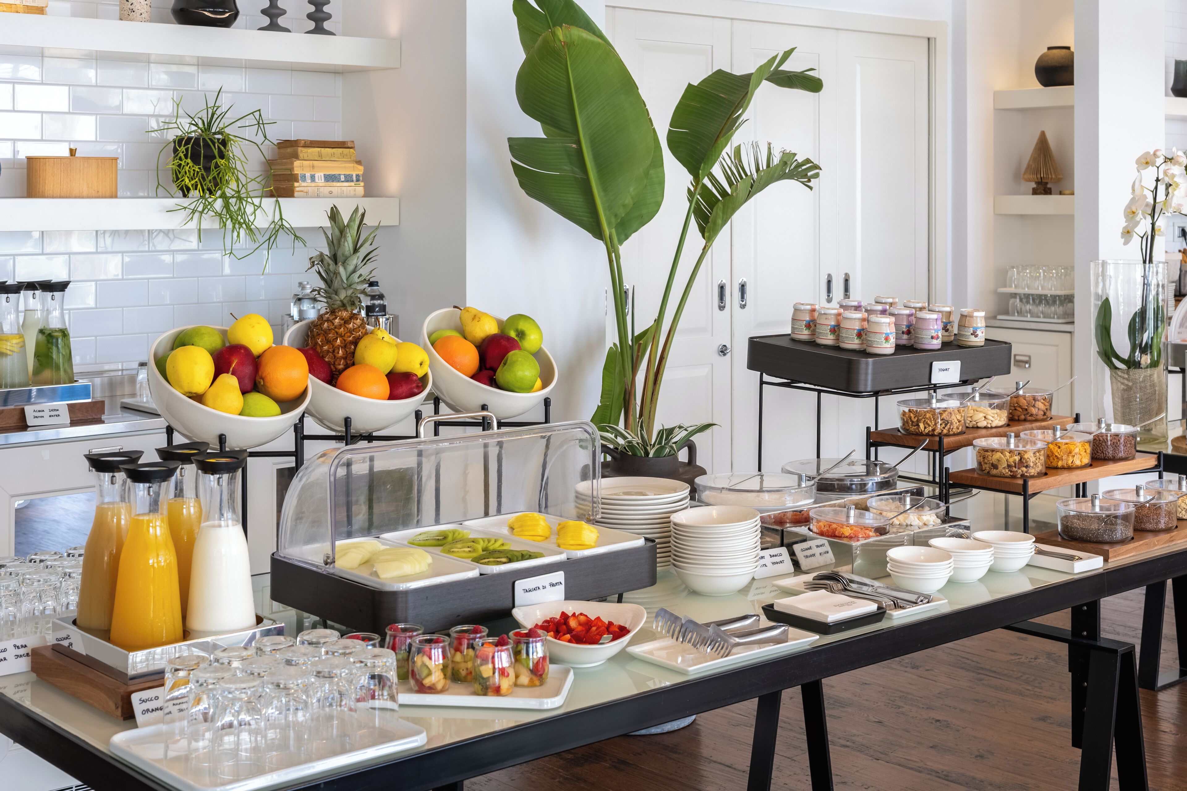 A buffet setup with various food items and beverages.