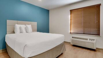 Suite, 1 Queen Bed, Non Smoking | Desk, laptop workspace, iron/ironing board, free WiFi