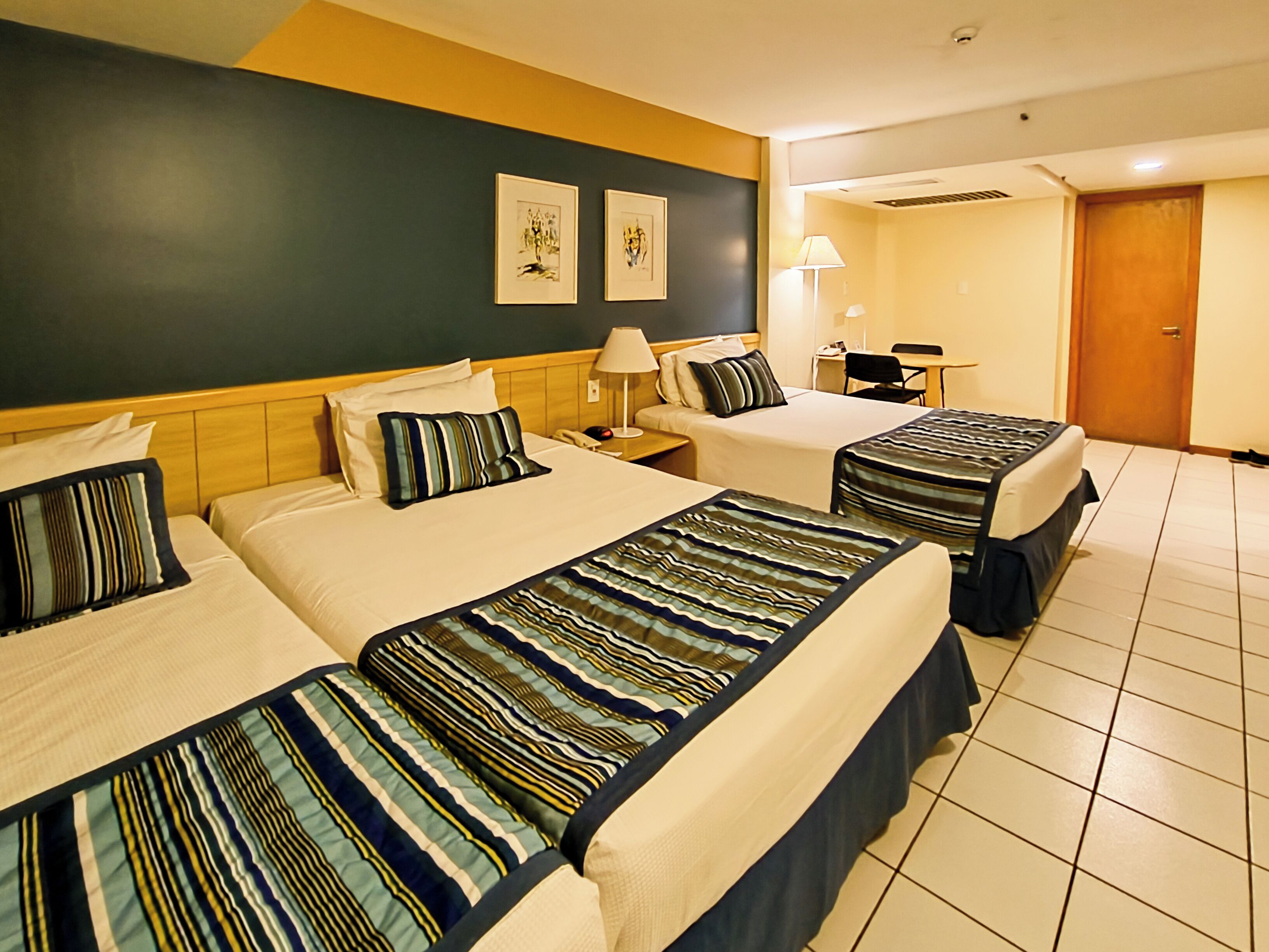 deluxe triple room | 1 bedroom, in-room safe, desk, laptop workspace