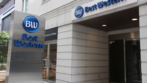 A Best Western hotel entrance with a prominent sign, a glass door, and a tiled facade. - Best Western Hotel Fino Osaka Shinsaibashi (Osaka)