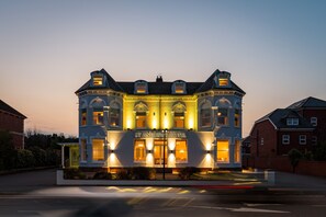 A large, historic building with a prominent entrance and multiple windows, labeled as St. Andrews Hotel. - St Andrews Hotel (Exeter)