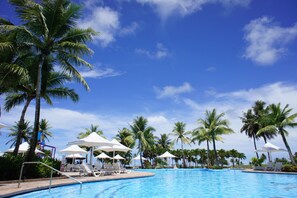 Outdoor pool, open 9 AM to 6 PM, pool umbrellas, pool loungers