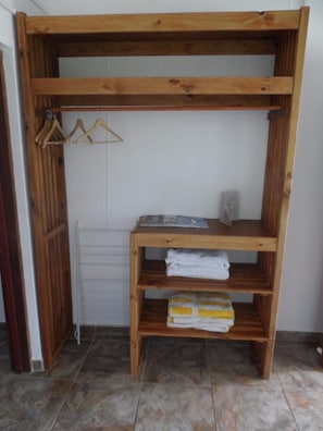 A stylish shelf unit with a radiator below, perfect for storing essentials.
