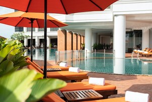 Outdoor pool, pool umbrellas, sun loungers