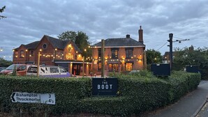 A traditional brick building with a sign for 'The Boot' bar lounge restaurant. - The Boot Inn (Worcester)