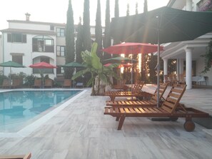 Outdoor pool, pool umbrellas, pool loungers
