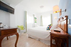 Triple Room | Pillowtop beds, minibar, in-room safe, individually decorated - Hotel Boutique Las Arenas (Santa Eulalia del Rio)