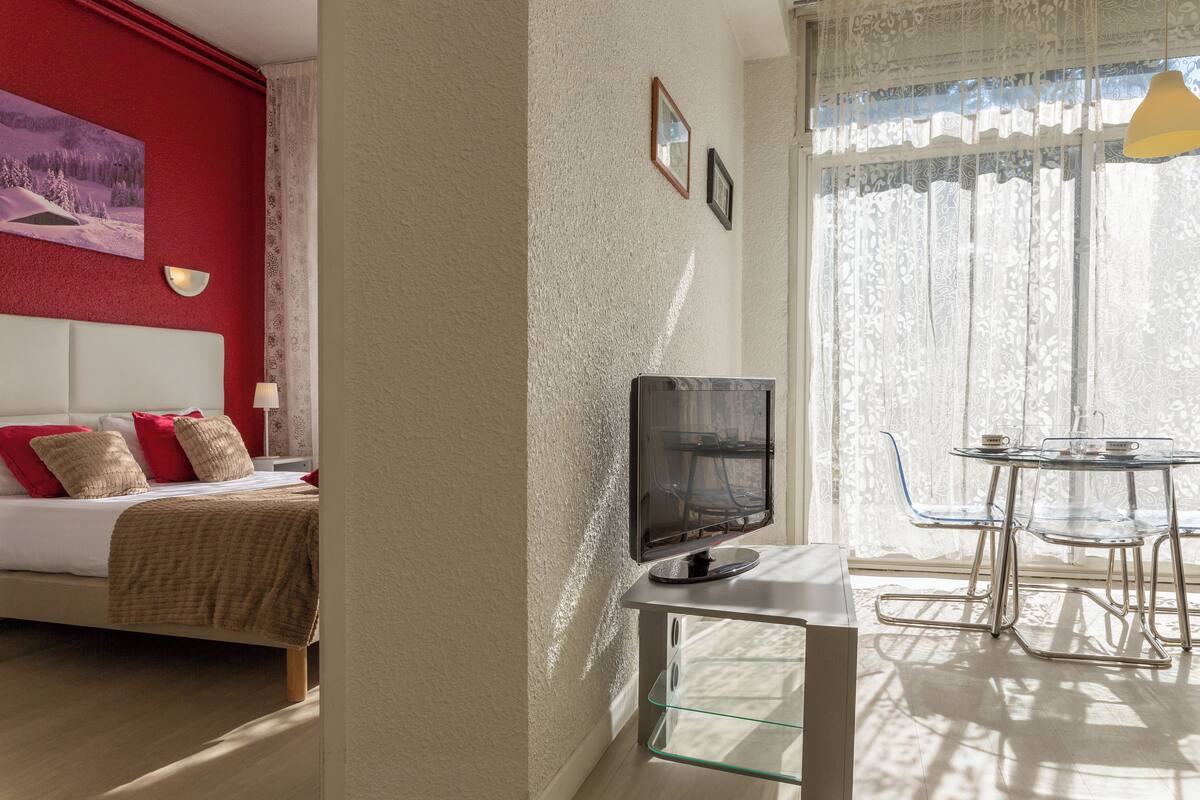 Desk, blackout curtains, soundproofing, iron/ironing board (on request)
