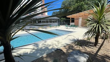 Seasonal outdoor pool, pool loungers