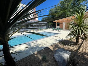 Seasonal outdoor pool, pool loungers
