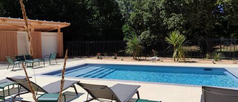 Seasonal outdoor pool, pool loungers