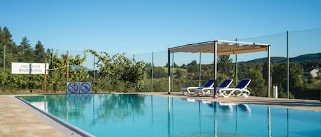 Seasonal outdoor pool, pool umbrellas, pool loungers