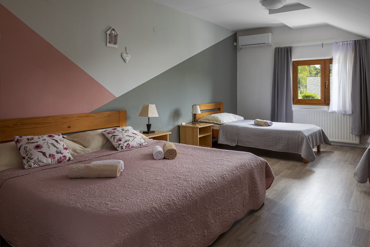 economy quadruple room (villa domagoj) | pillow-top beds, desk, laptop workspace, blackout curtains