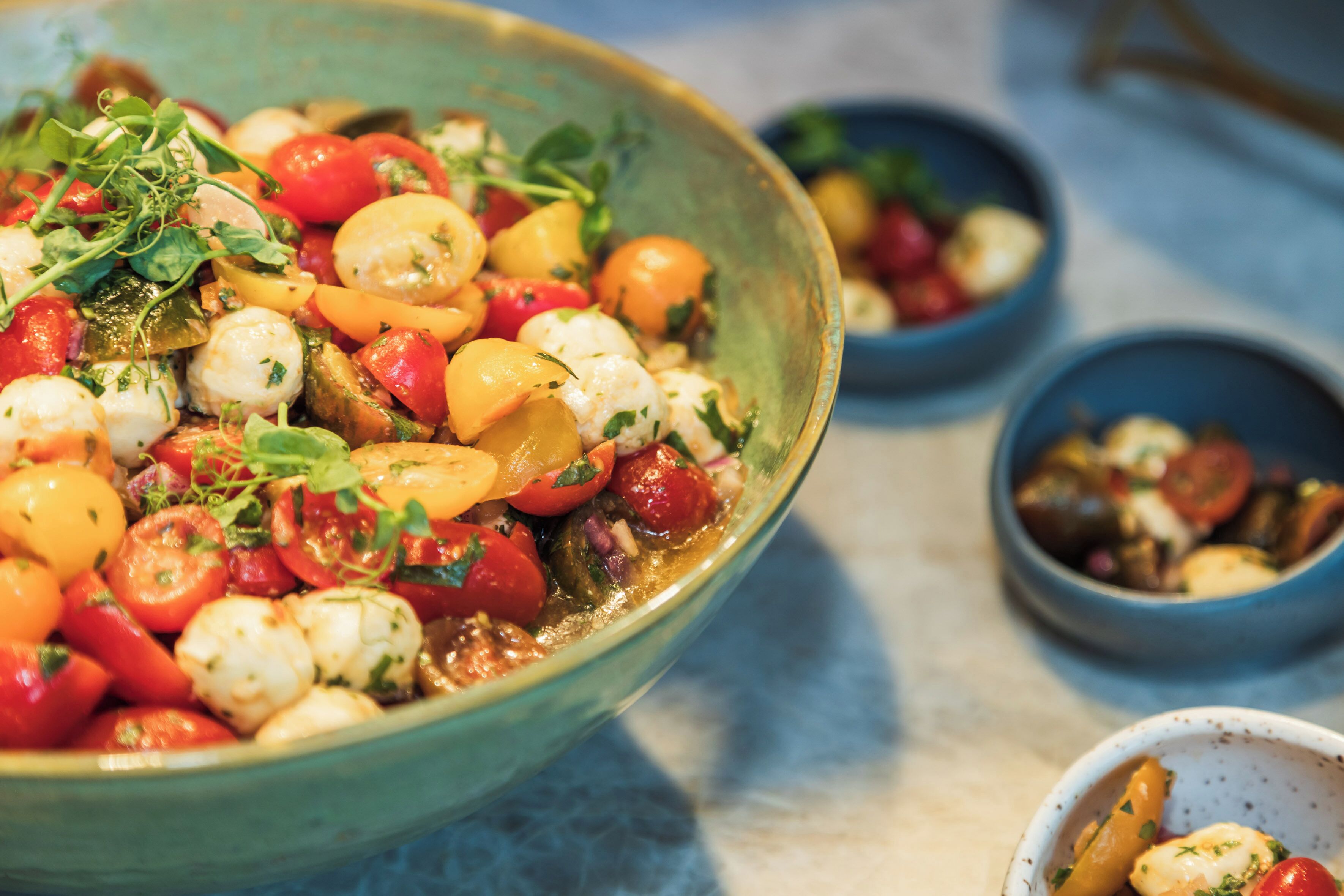 A bowl of mixed vegetables and cheese.