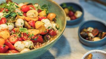 A bowl of mixed vegetables and cheese.
