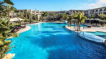 Indoor pool, outdoor pool, pool umbrellas