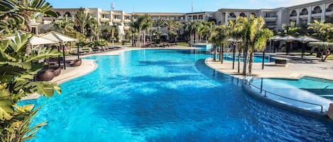 Indoor pool, outdoor pool, pool umbrellas