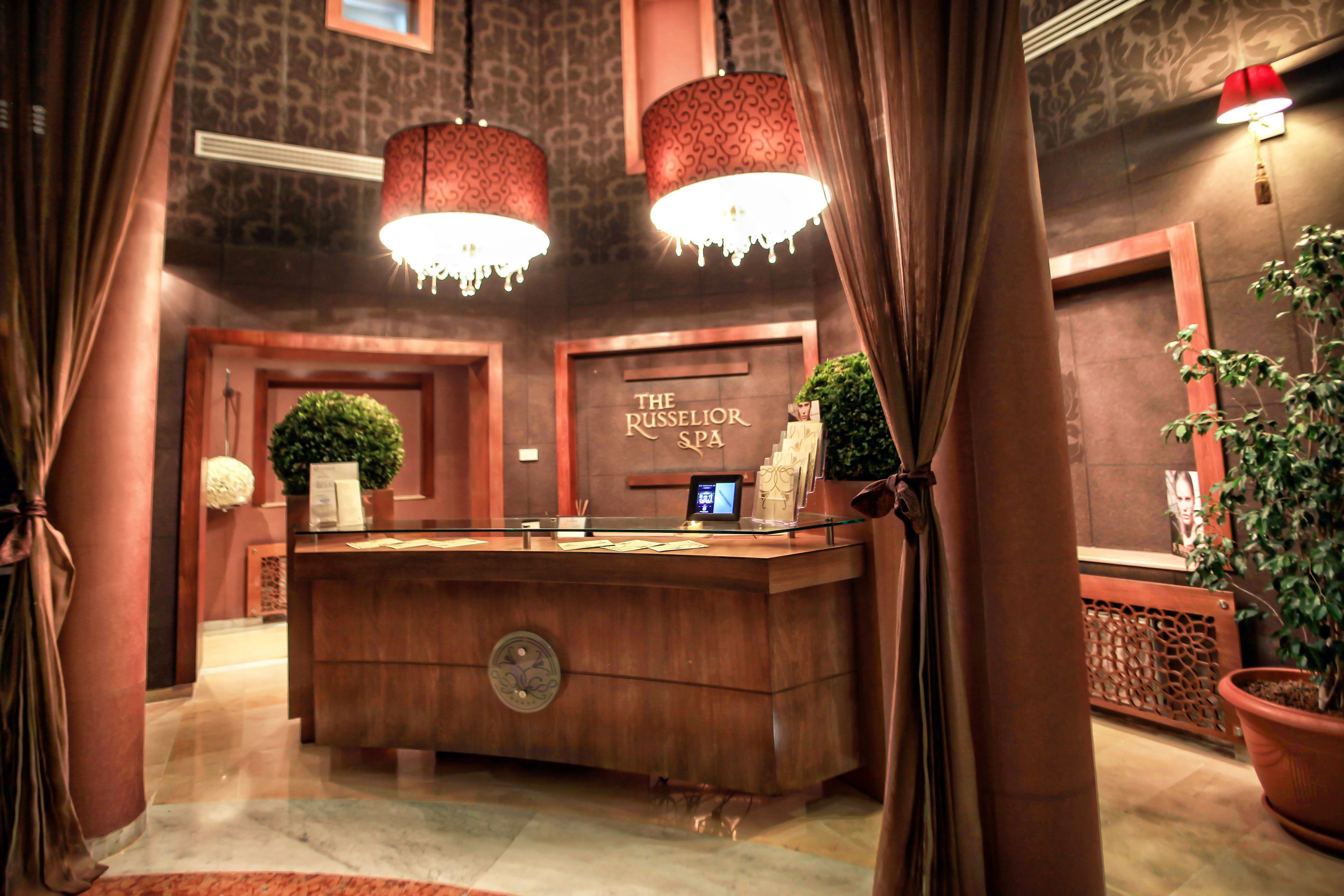 A reception desk with a sign reading "The Russell Spa".