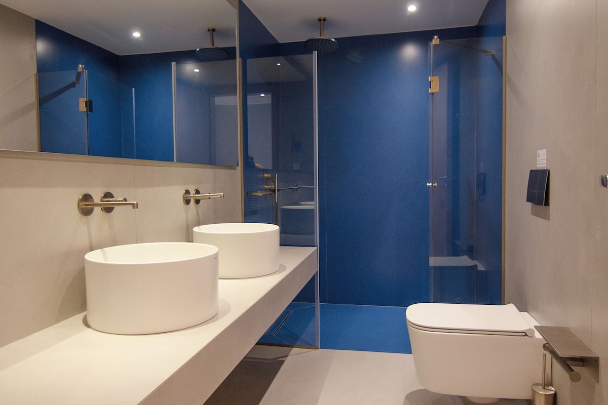 luxury suite | bathroom | shower, rainfall showerhead, designer toiletries, hair dryer