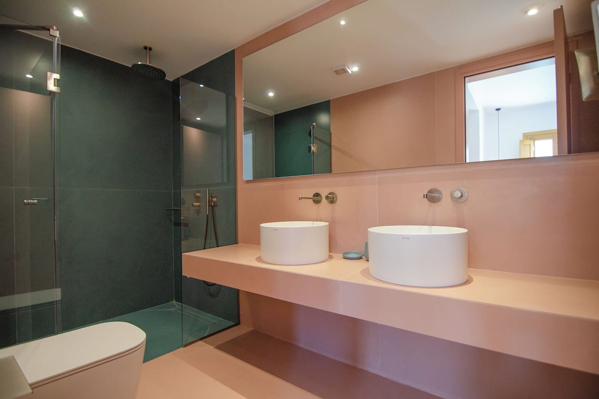 luxury suite | bathroom | shower, rainfall showerhead, designer toiletries, hair dryer