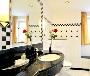 Combined shower/bathtub, free toiletries, hair dryer, bathrobes