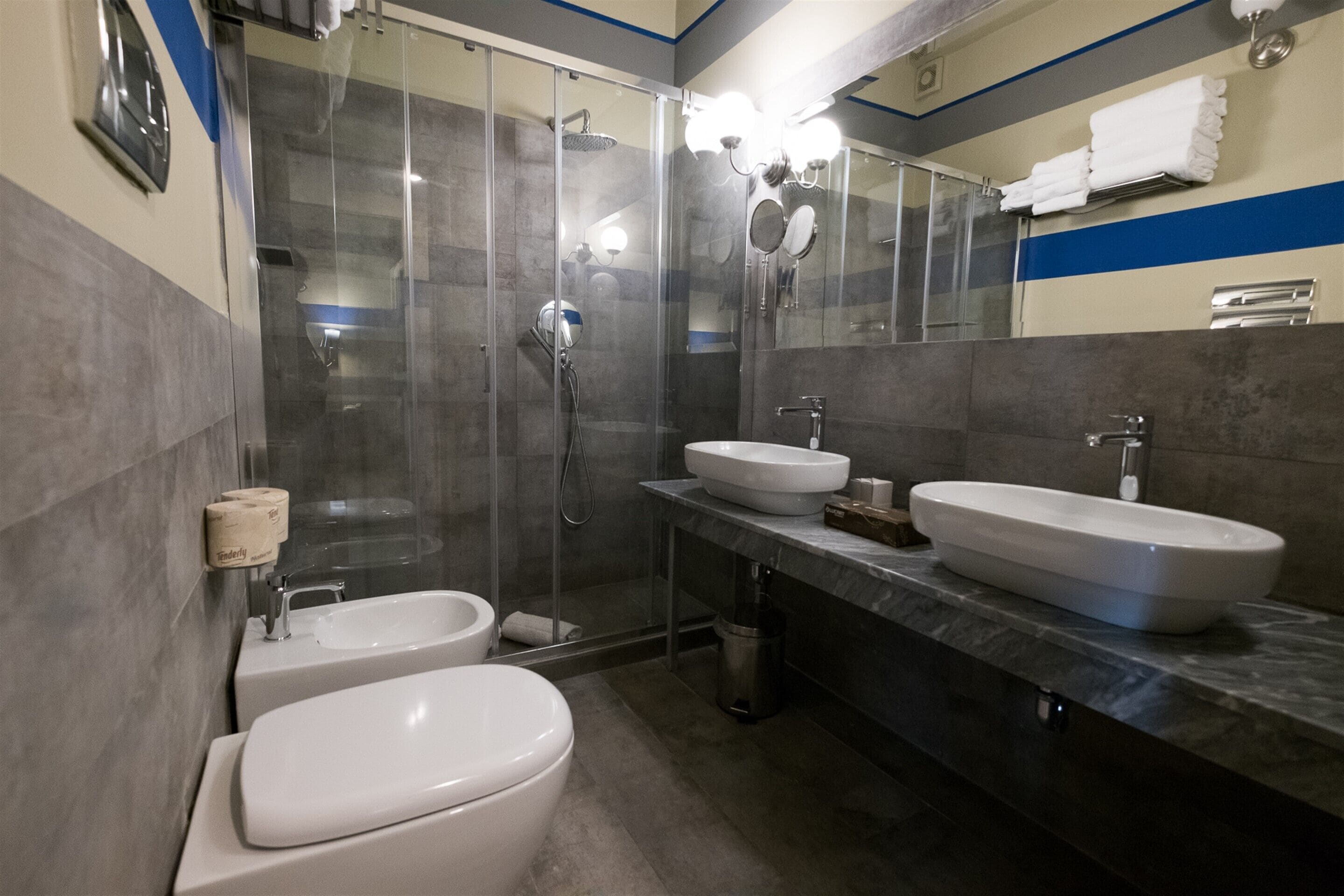 family quadruple room, multiple beds | bathroom | shower, free toiletries, hair dryer, bidet