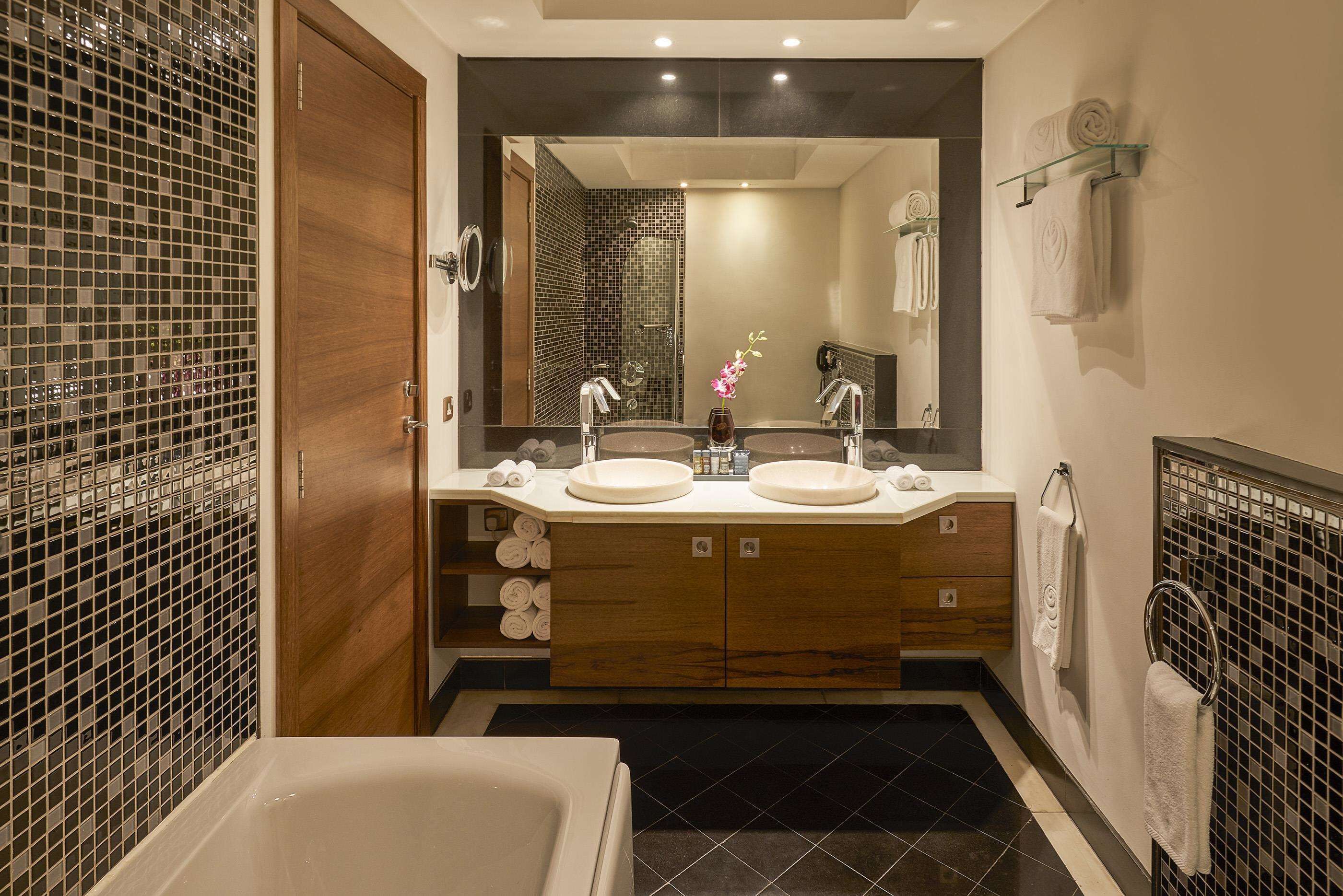 spring water bathtub, rainfall showerhead, free toiletries, hair dryer