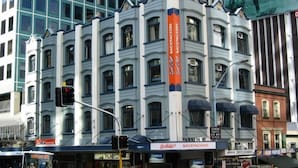 A multi-story building with a storefront at street level.