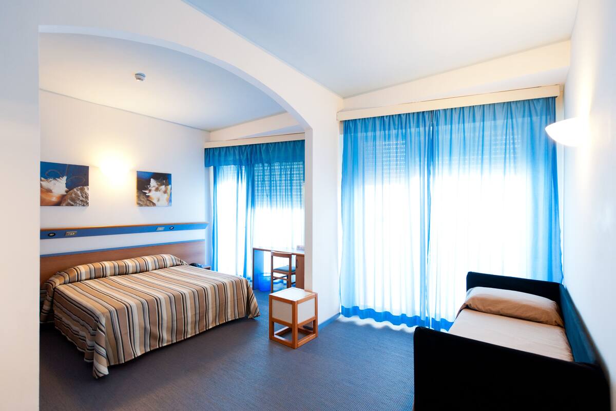 Family Quadruple Room, Balcony, Ocean View | Minibar, in-room safe, desk