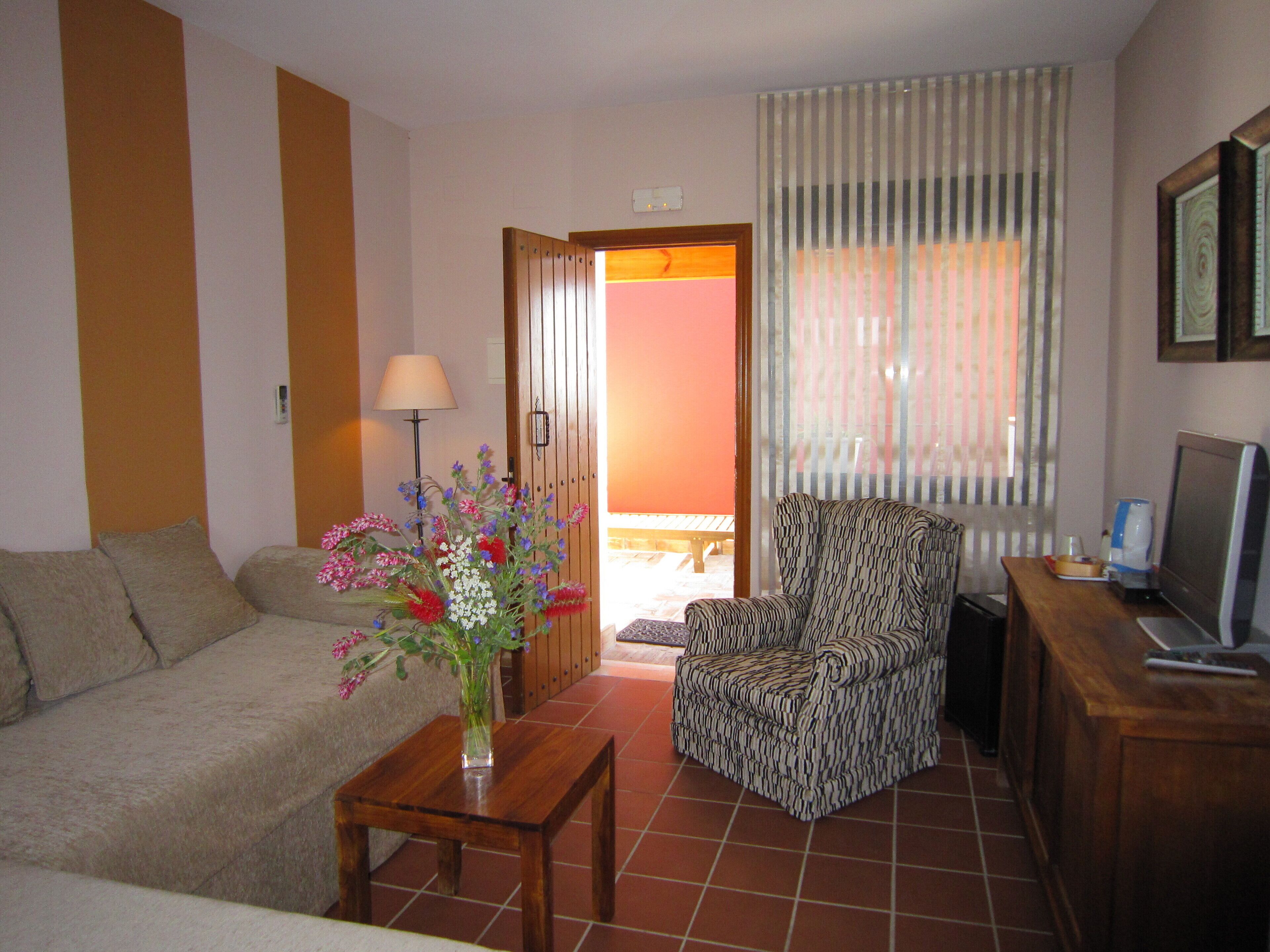 family studio suite | living area | tv