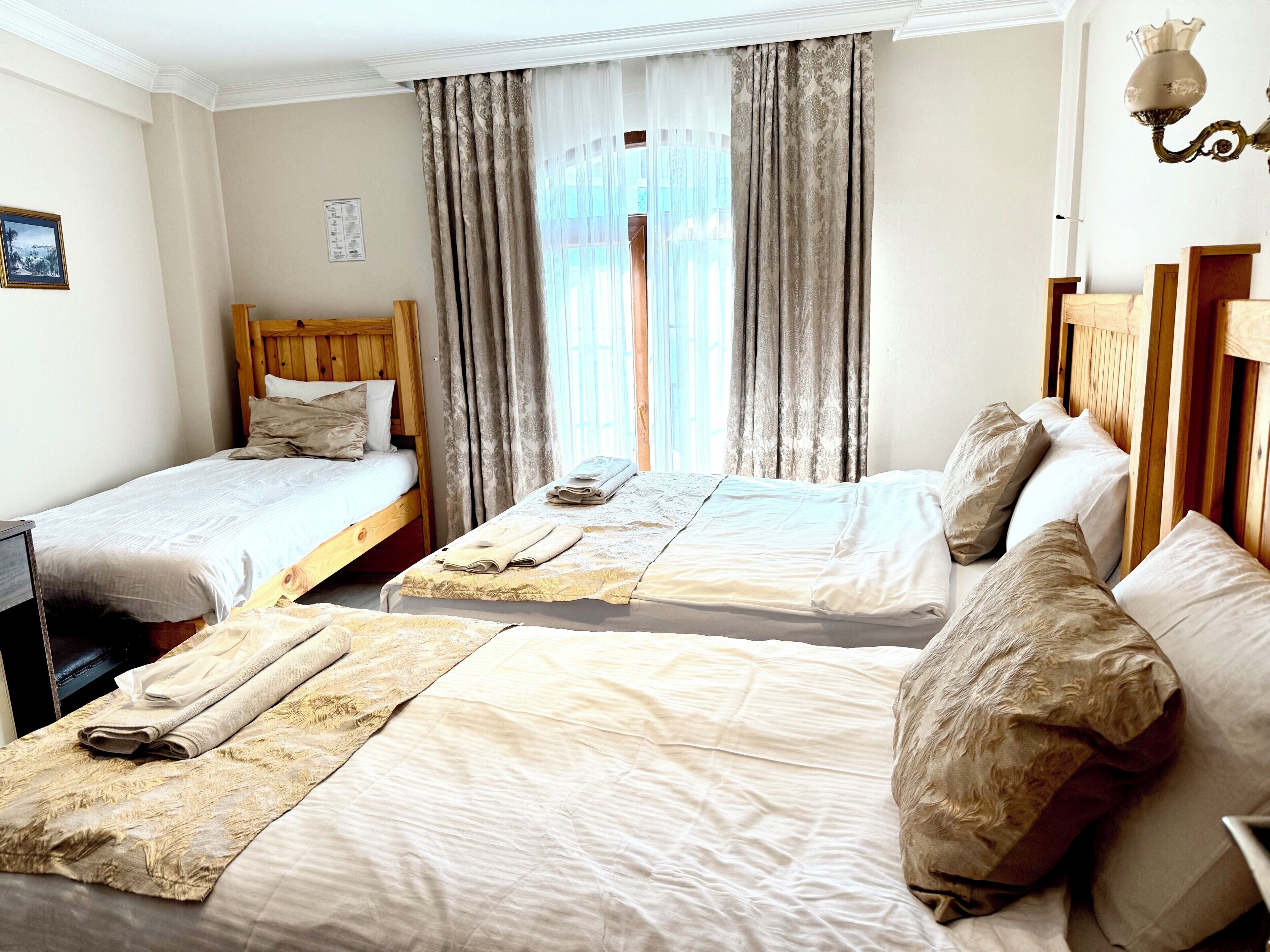 Triple Room | Hypo-allergenic bedding, in-room safe, individually decorated, desk