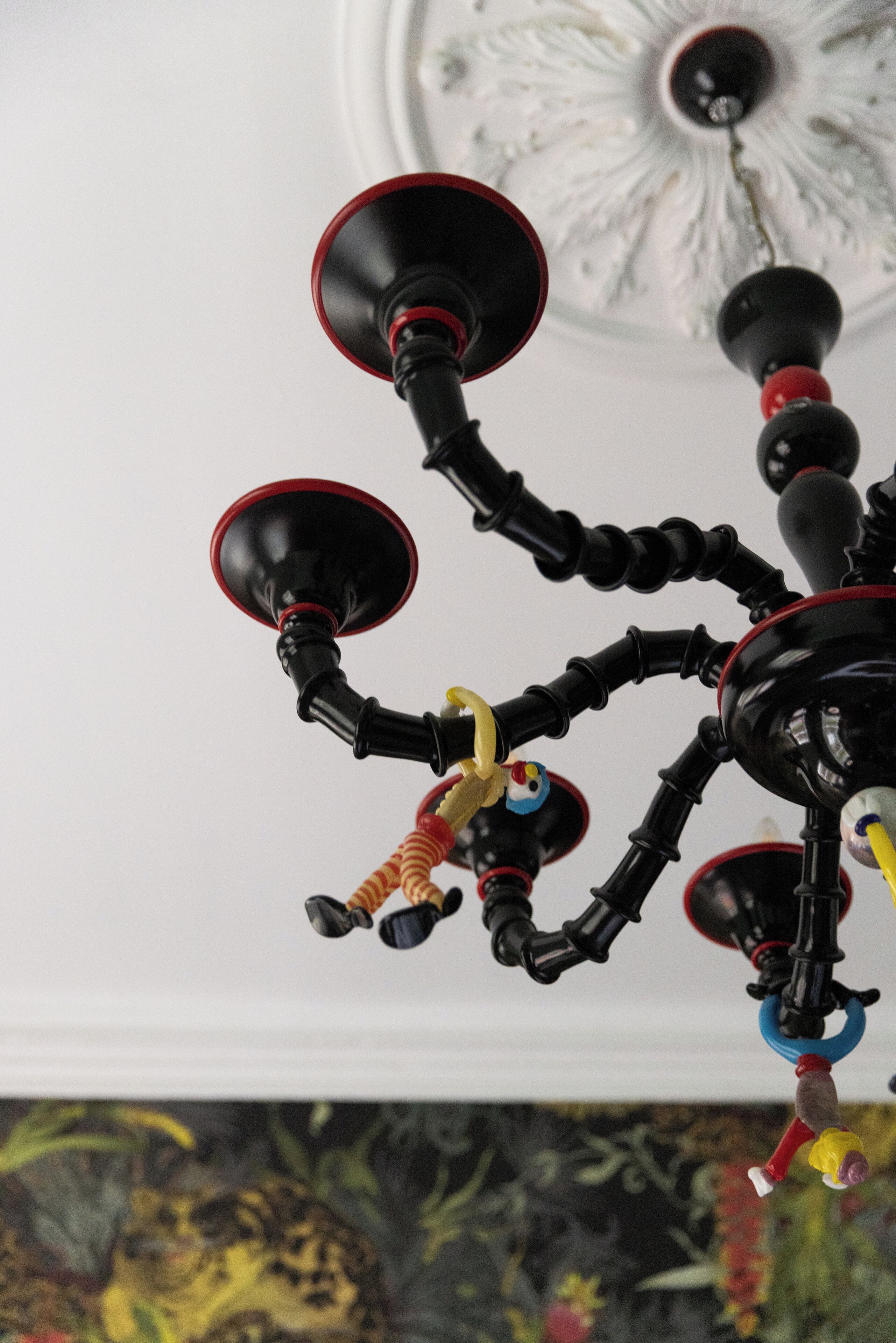 A chandelier with multiple arms and hanging ornaments.