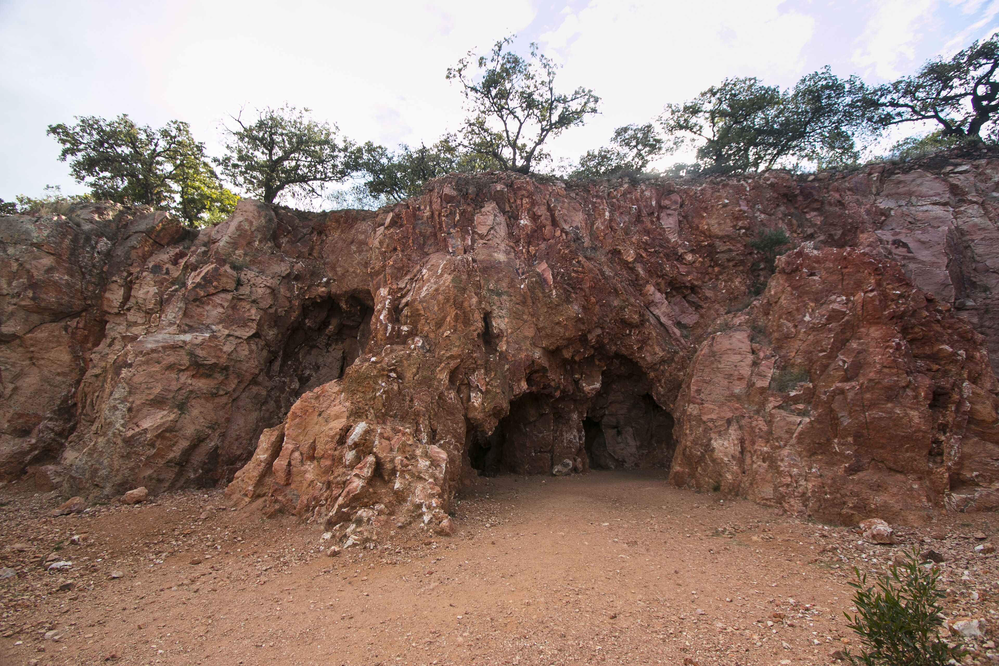 A natural rock formation with two caves.