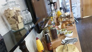 A buffet table with various food items including fruits, pastries, and condiments. - House Tina - Bed and Breakfast (Rakovica)