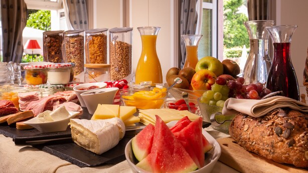 A breakfast buffet with various food items and beverages. - Goldener Adler Oberried - Hotel & Appartements (Oberried)