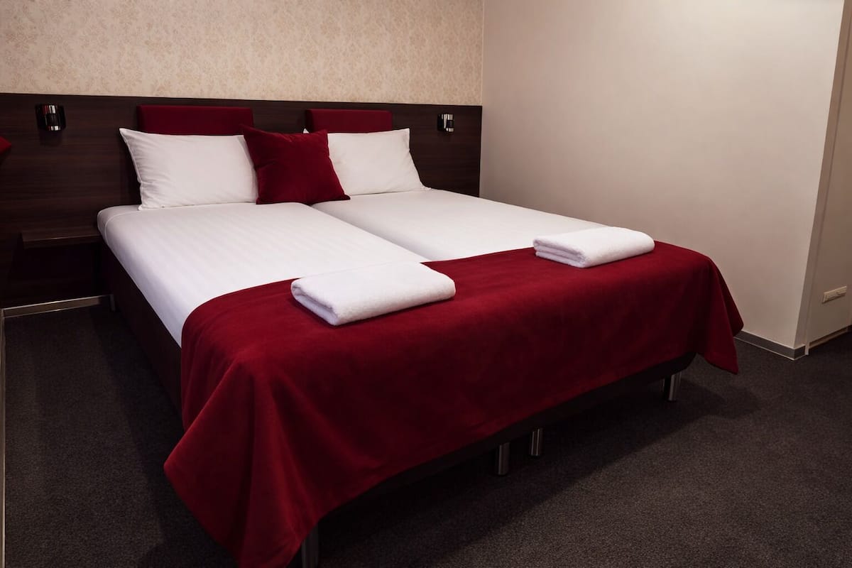 Double Room, Private Bathroom | Minibar, desk, blackout drapes, rollaway beds