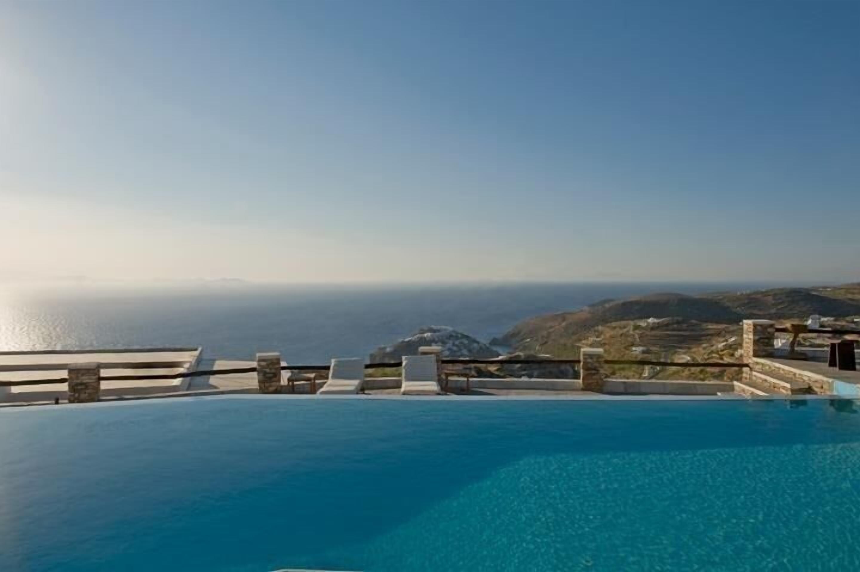 seasonal outdoor pool, open 8:00 am to 9:00 pm, pool umbrellas