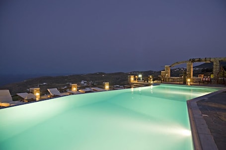 Seasonal outdoor pool, open 8:00 AM to 9:00 PM, pool umbrellas