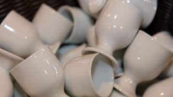 A collection of white ceramic cups.