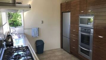 Superior Villa, 2 Bedrooms, Garden View, Garden Area | Private kitchen | Fridge, microwave, coffee/tea maker, electric kettle