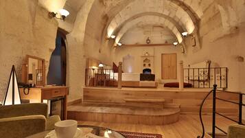 Family Cave Suite, 2 Bedrooms with Jacuzzi | Living area | LCD TV