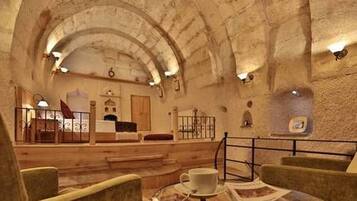 Family Cave Suite, 2 Bedrooms with Jacuzzi | Free minibar items, laptop workspace, blackout drapes, soundproofing