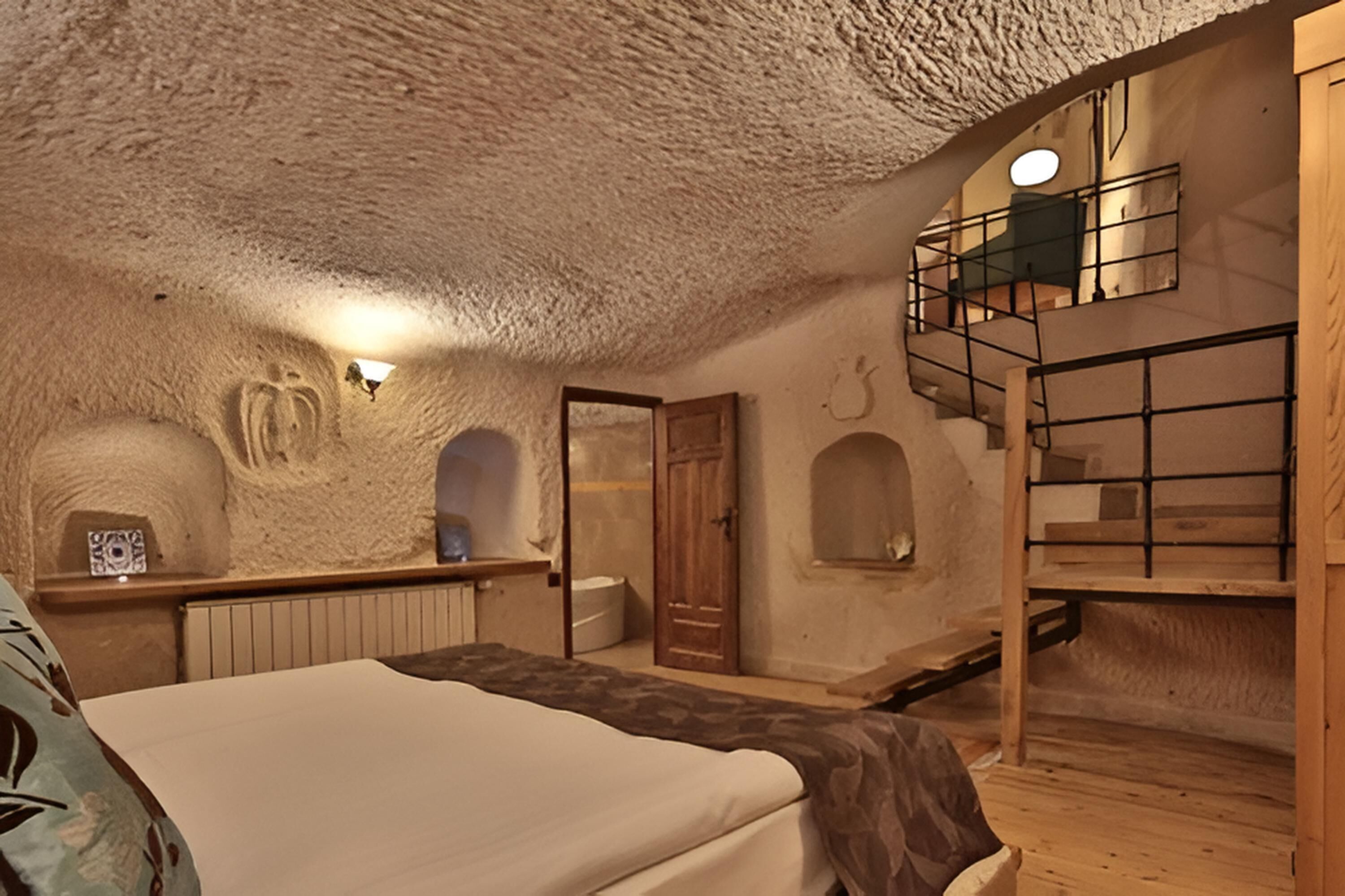 honeymoon cave suit with jacuzzi | free minibar items, laptop workspace, blackout curtains, soundproofing
